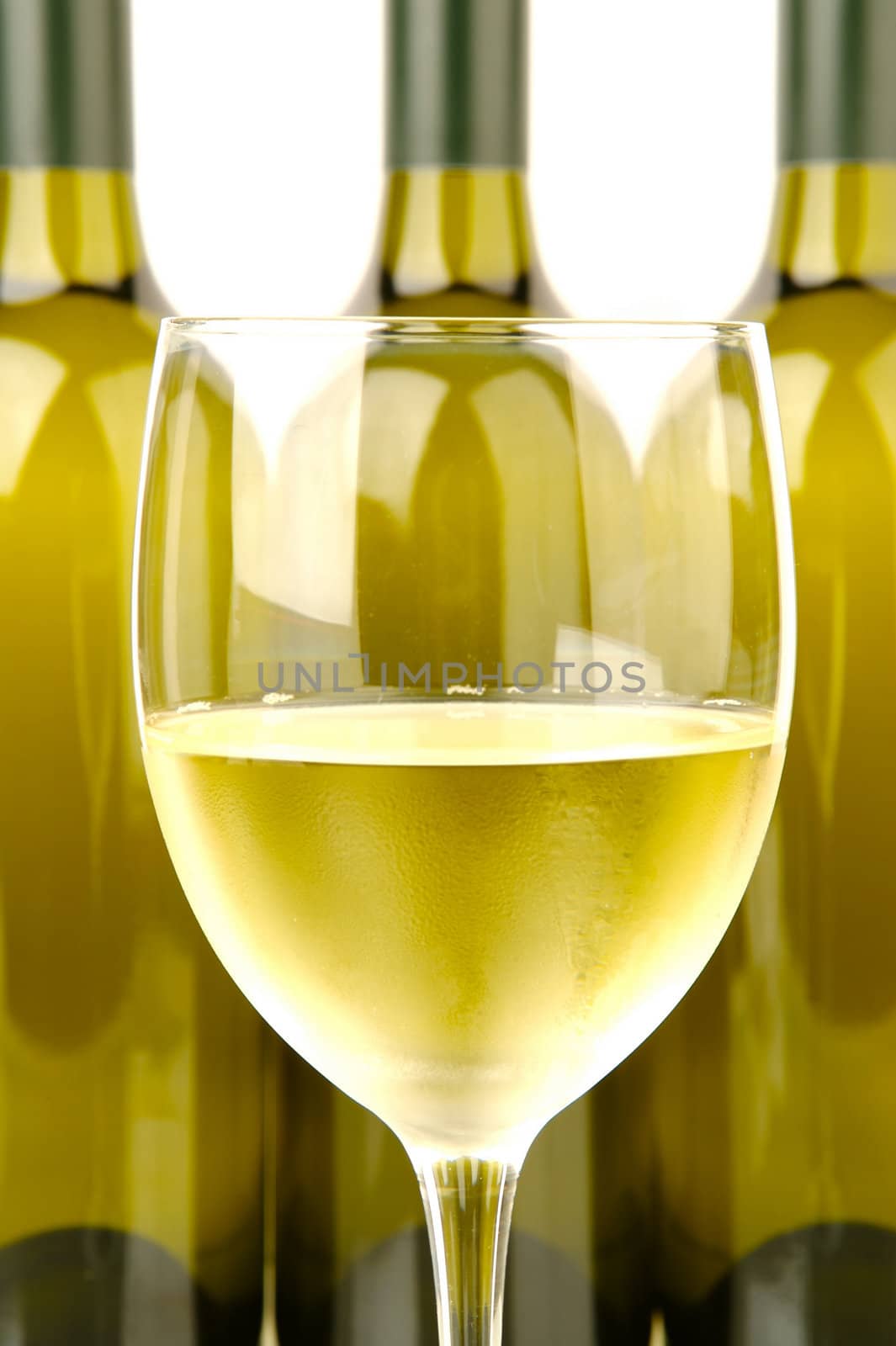 White wine bottles isolated against a white background