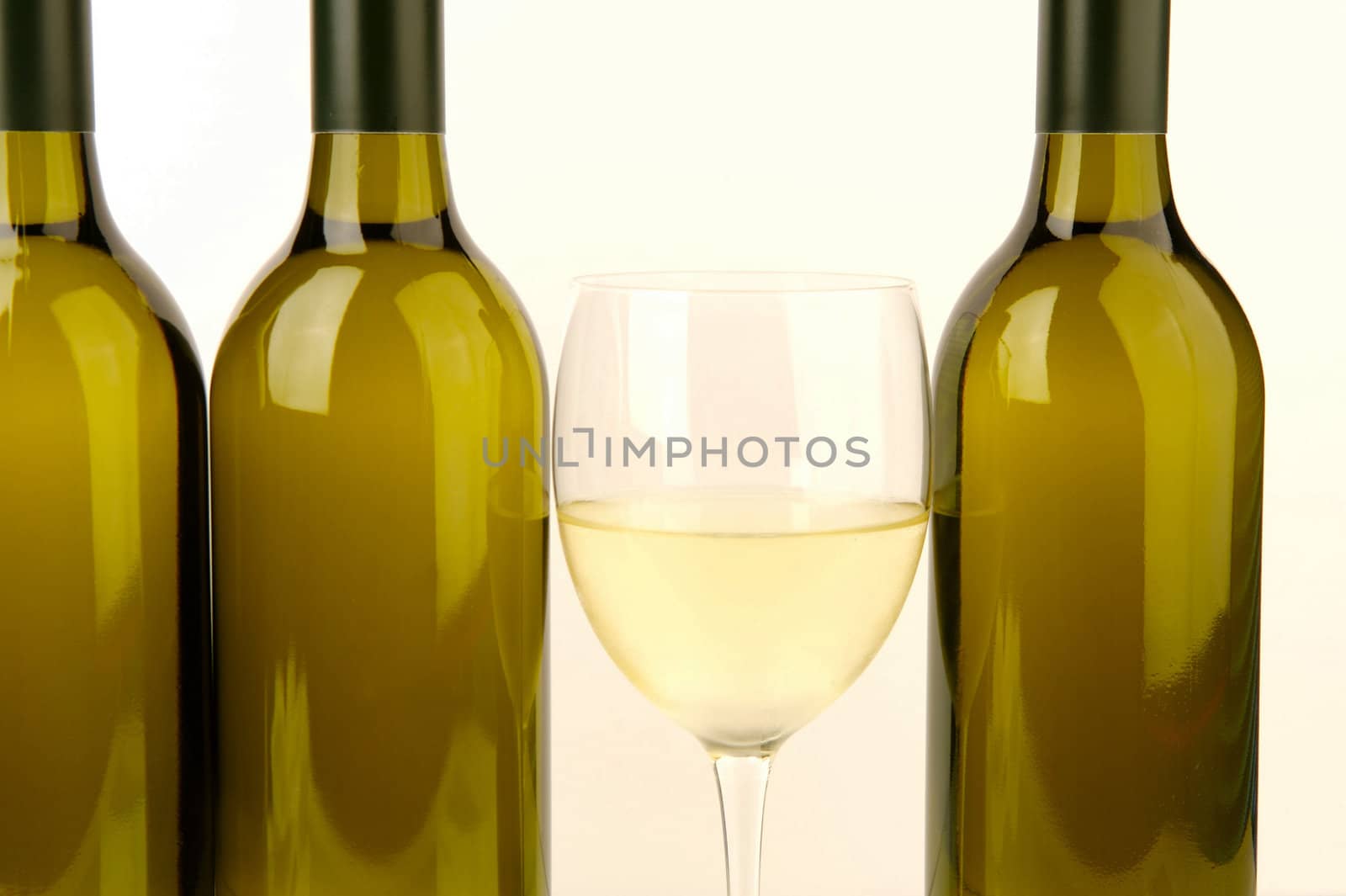White wine bottles isolated against a white background