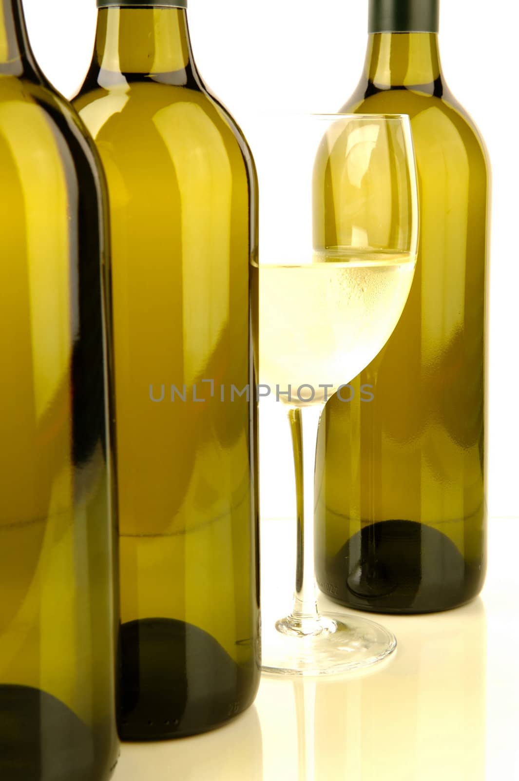 White wine bottles isolated against a white background