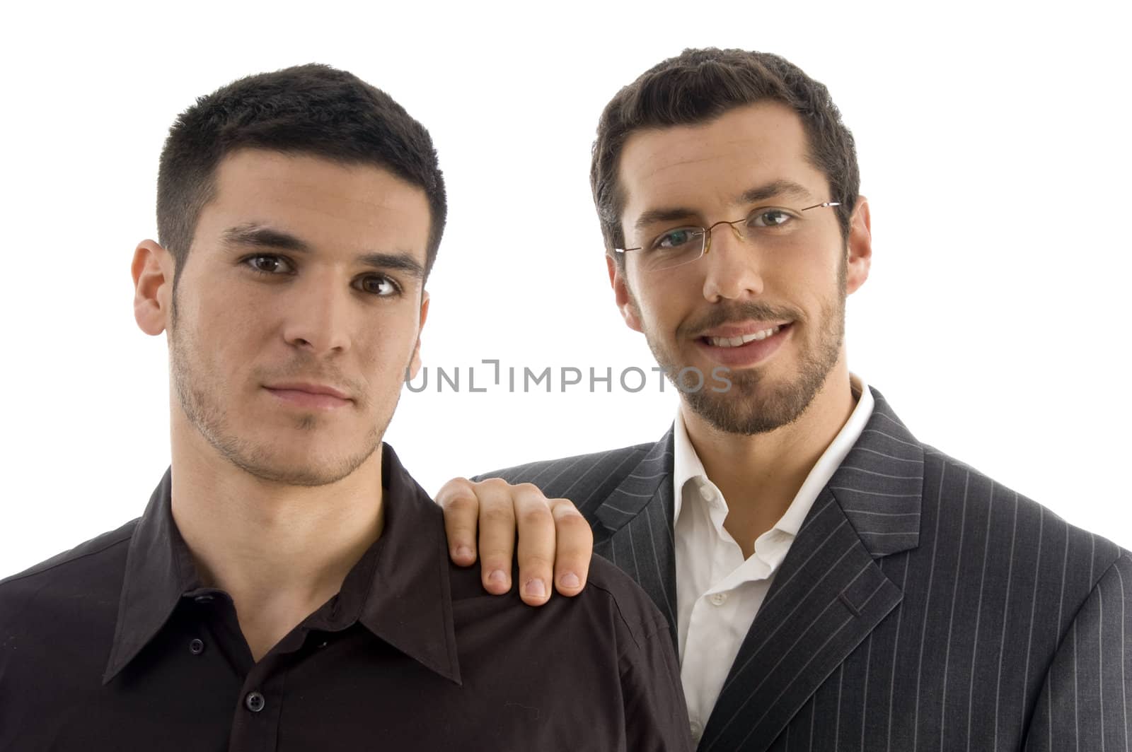 businesspeople standing together and looking at camera on an isolated white background