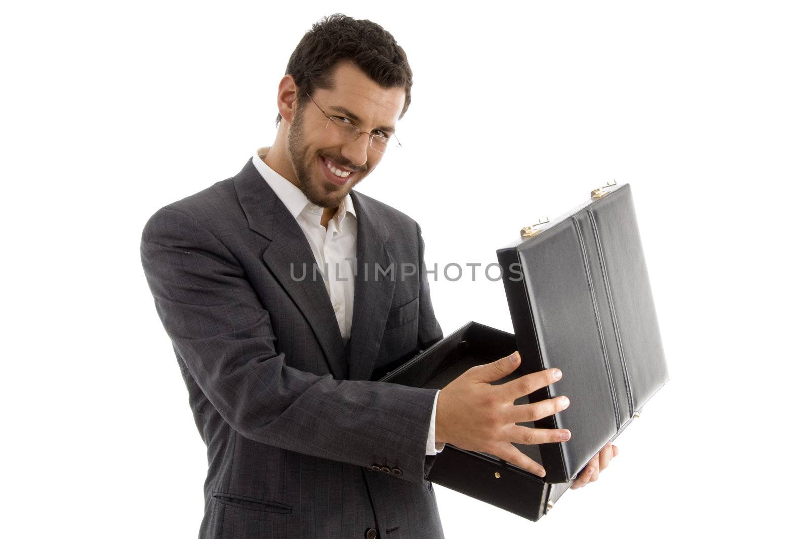 successful attorney smiling and opening his bag against white background