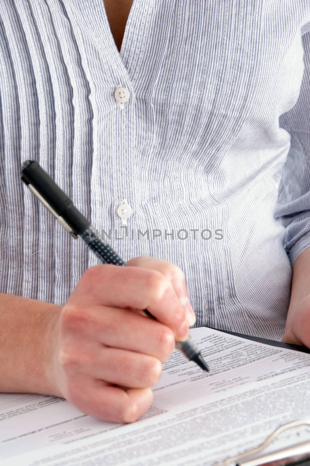 close up of pen and paper on an isolated white background