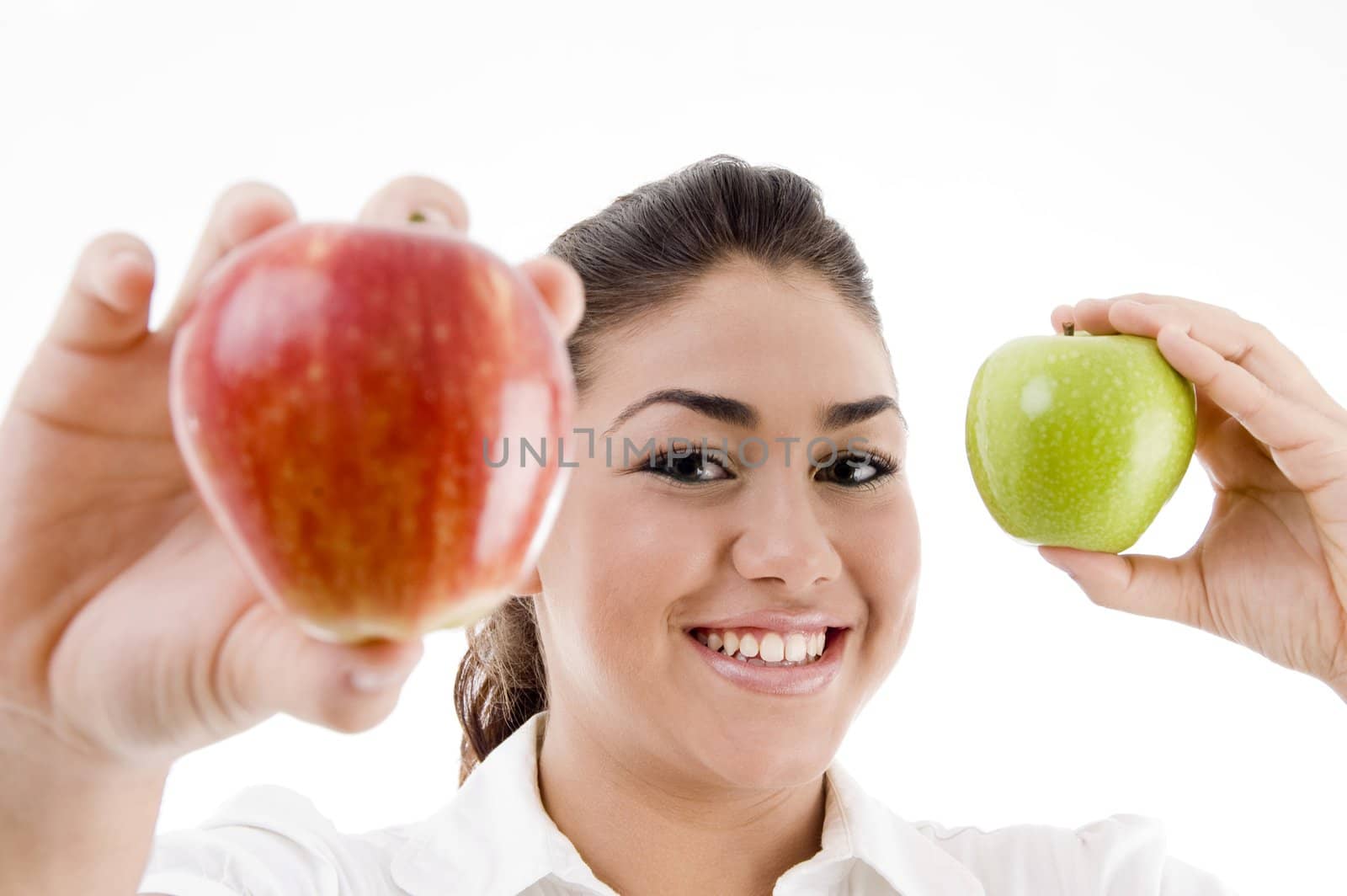 young attractive model showing green and red apple with white background