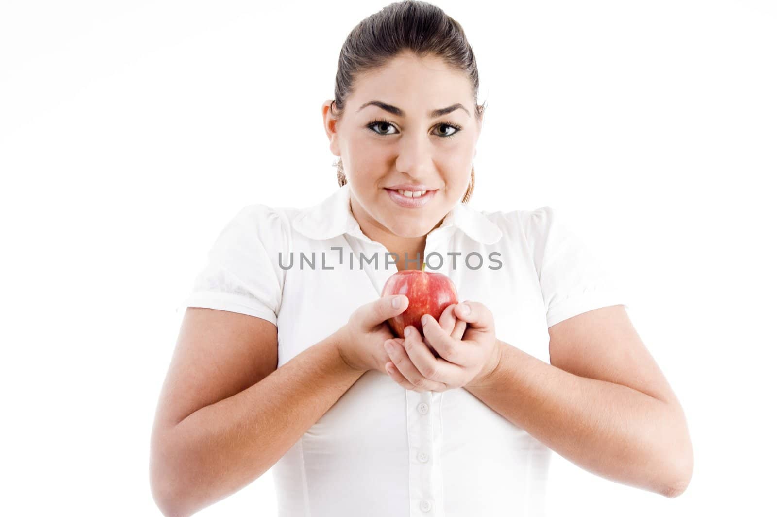 pretty young caucasian holding an apple on an isolated background