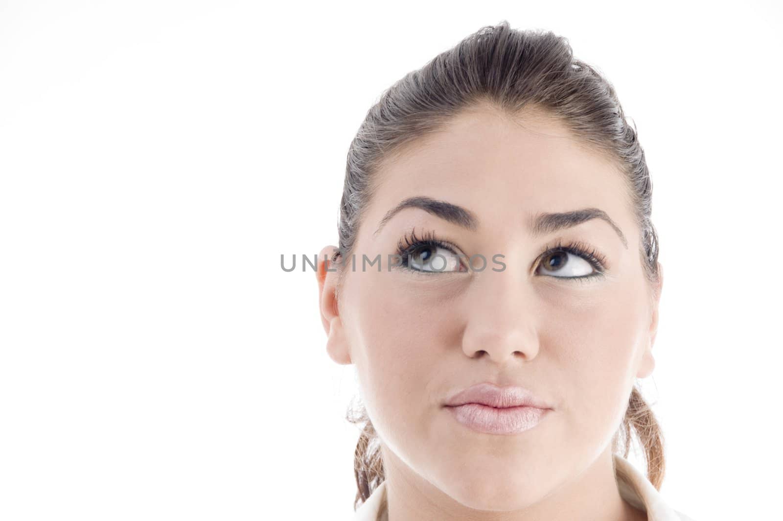 close up of young attractive model looking upwards with white background