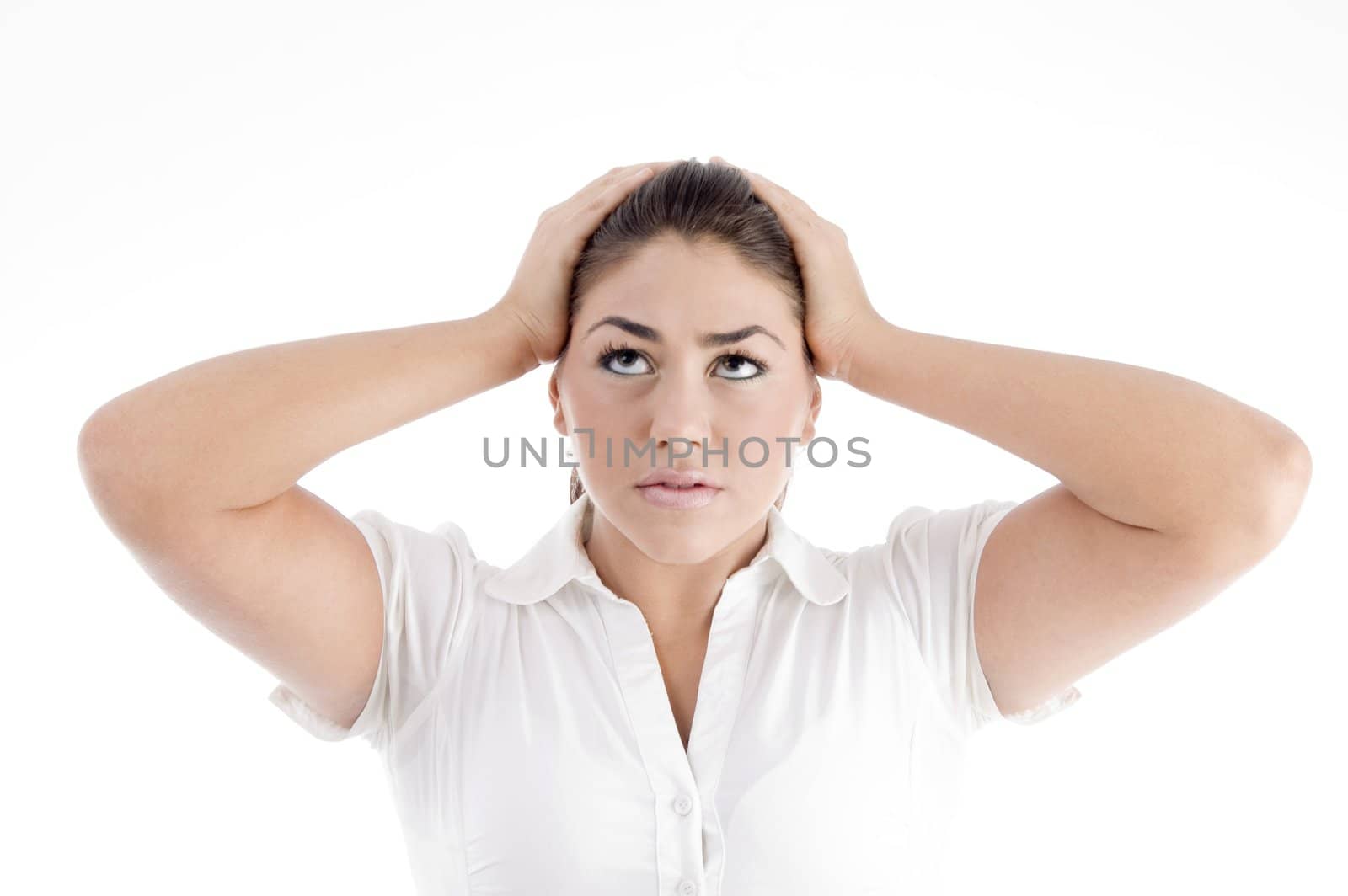 pretty young caucasian tensed against white background