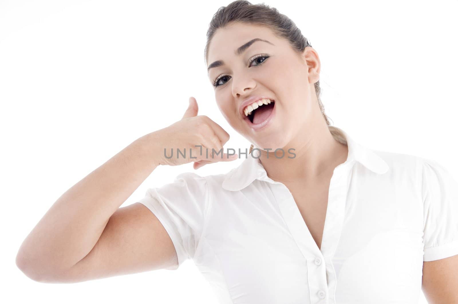 beautiful young female making a phone call hand gesture on an isolated white background