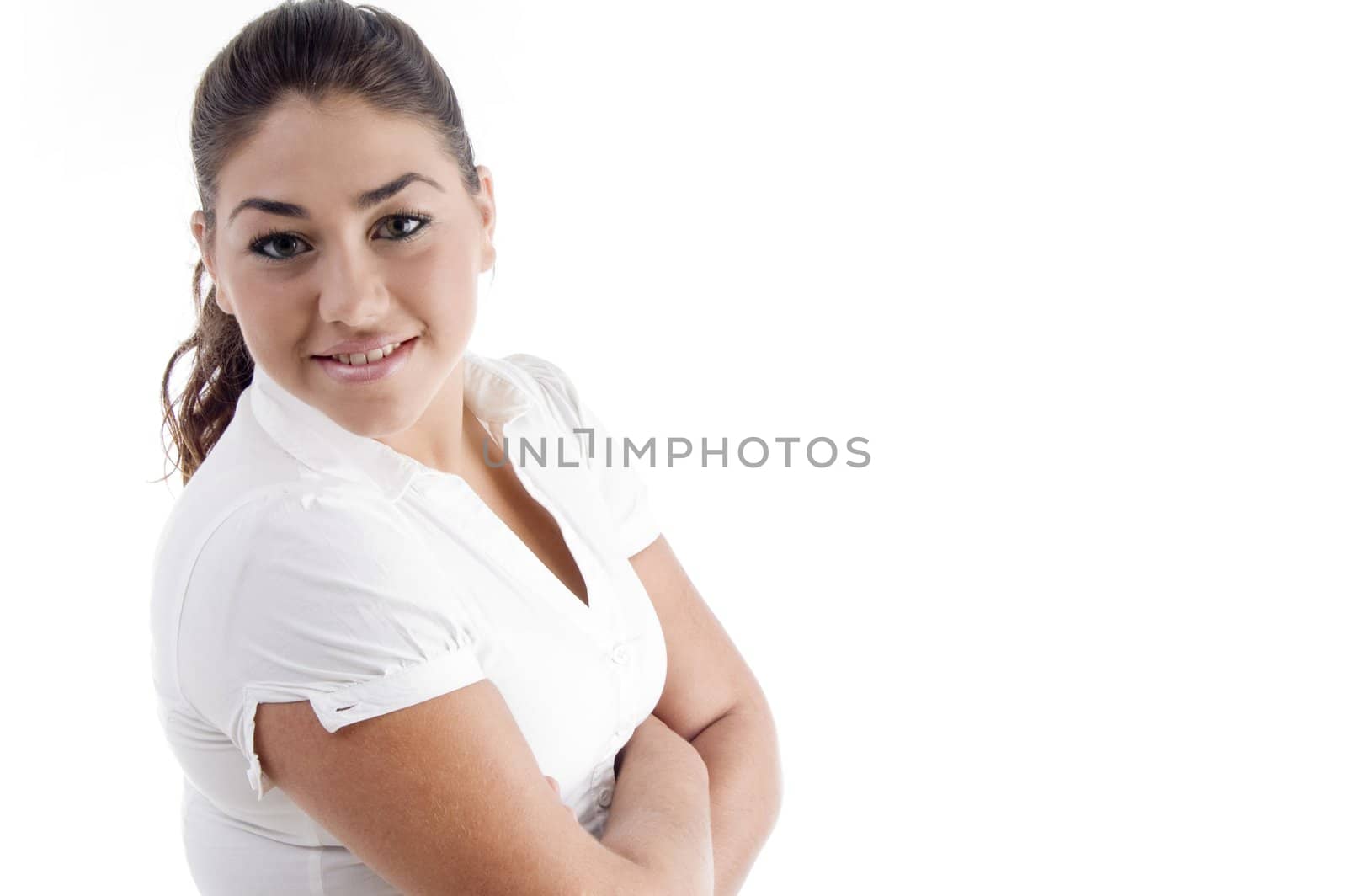 pretty young caucasian posing with arms crossed against white background