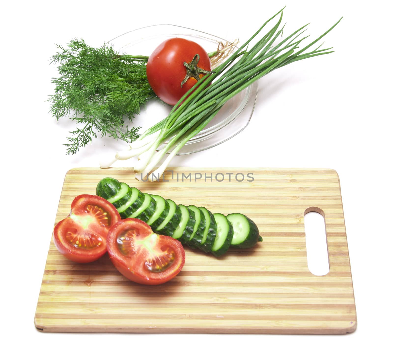 tomatoes and cucumbers on the cutting board