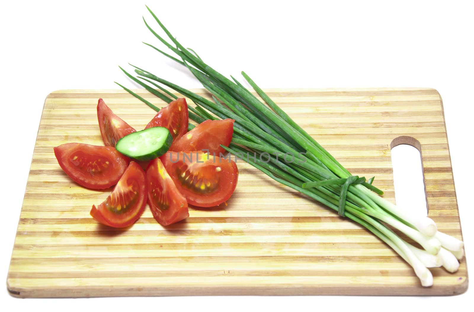 tomatoes and cucumbers on the cutting board