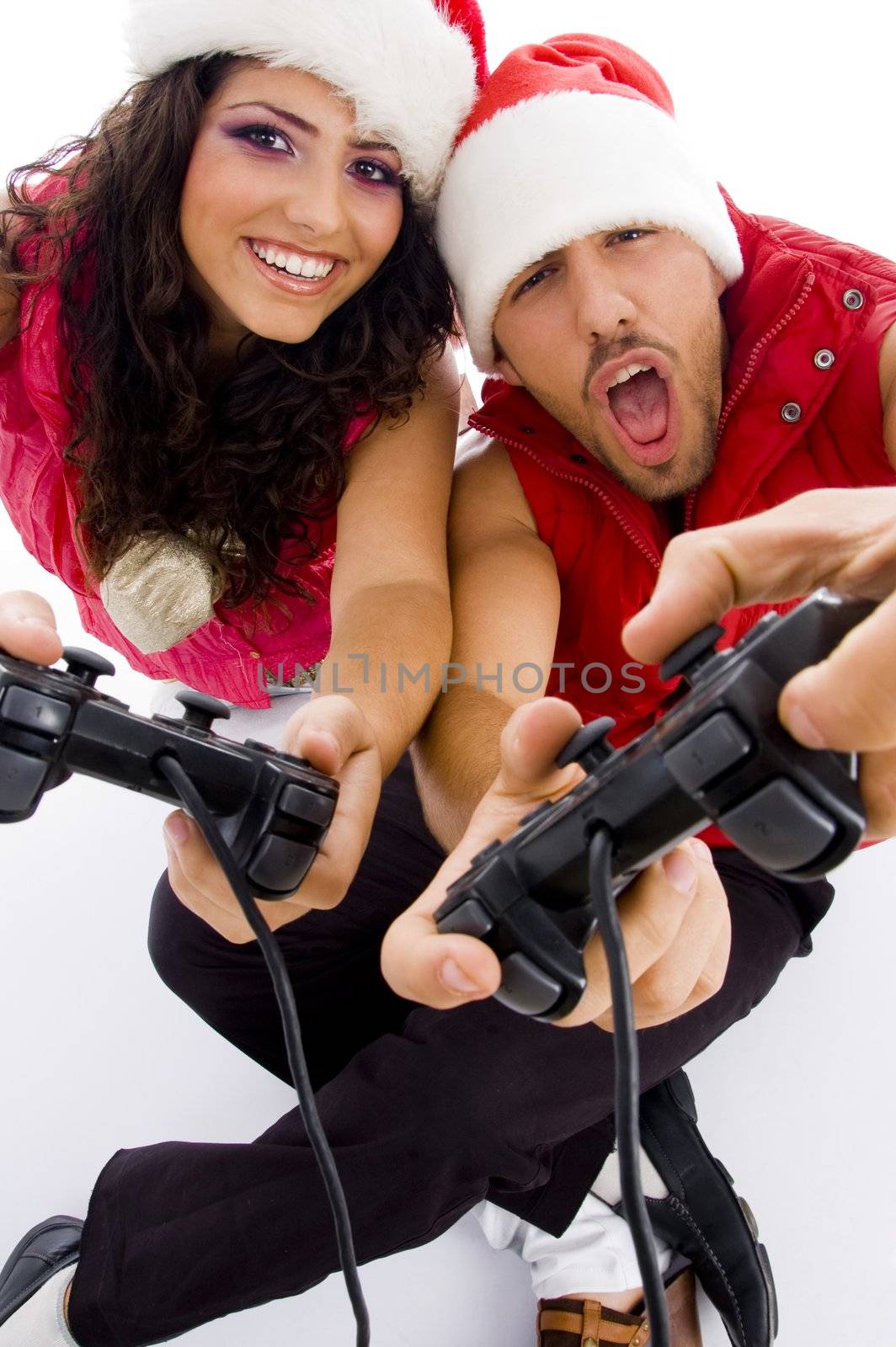 young loving couple on floor playing video game by imagerymajestic