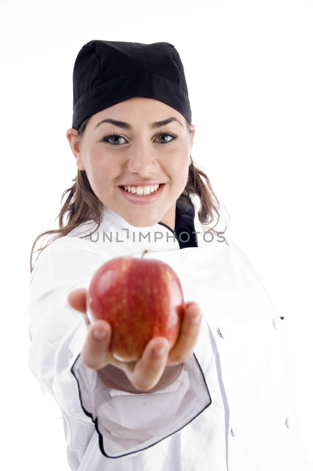 professional female chef showing fresh apple on an isolated white background