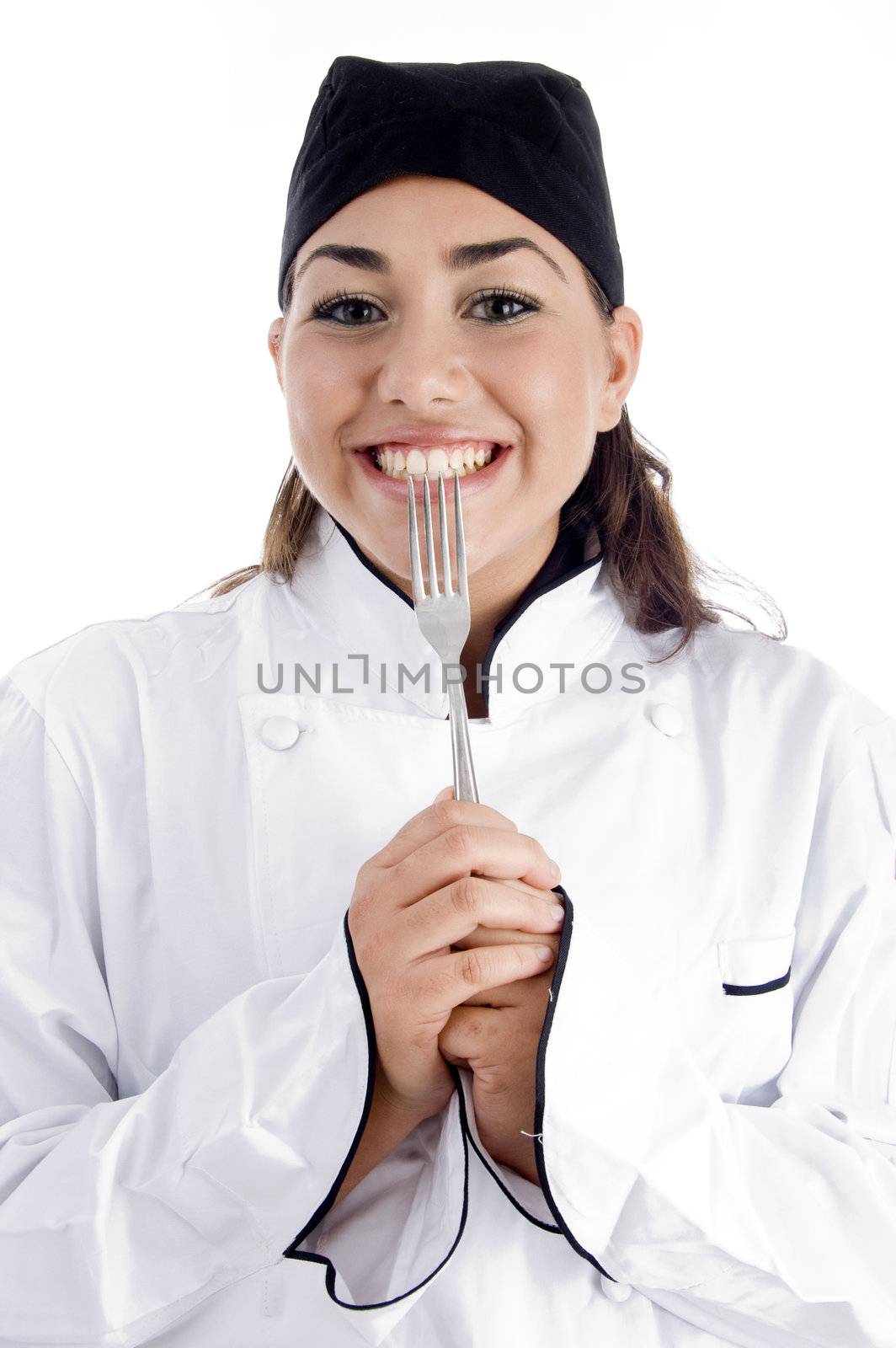 smiling female chef showing fork by imagerymajestic