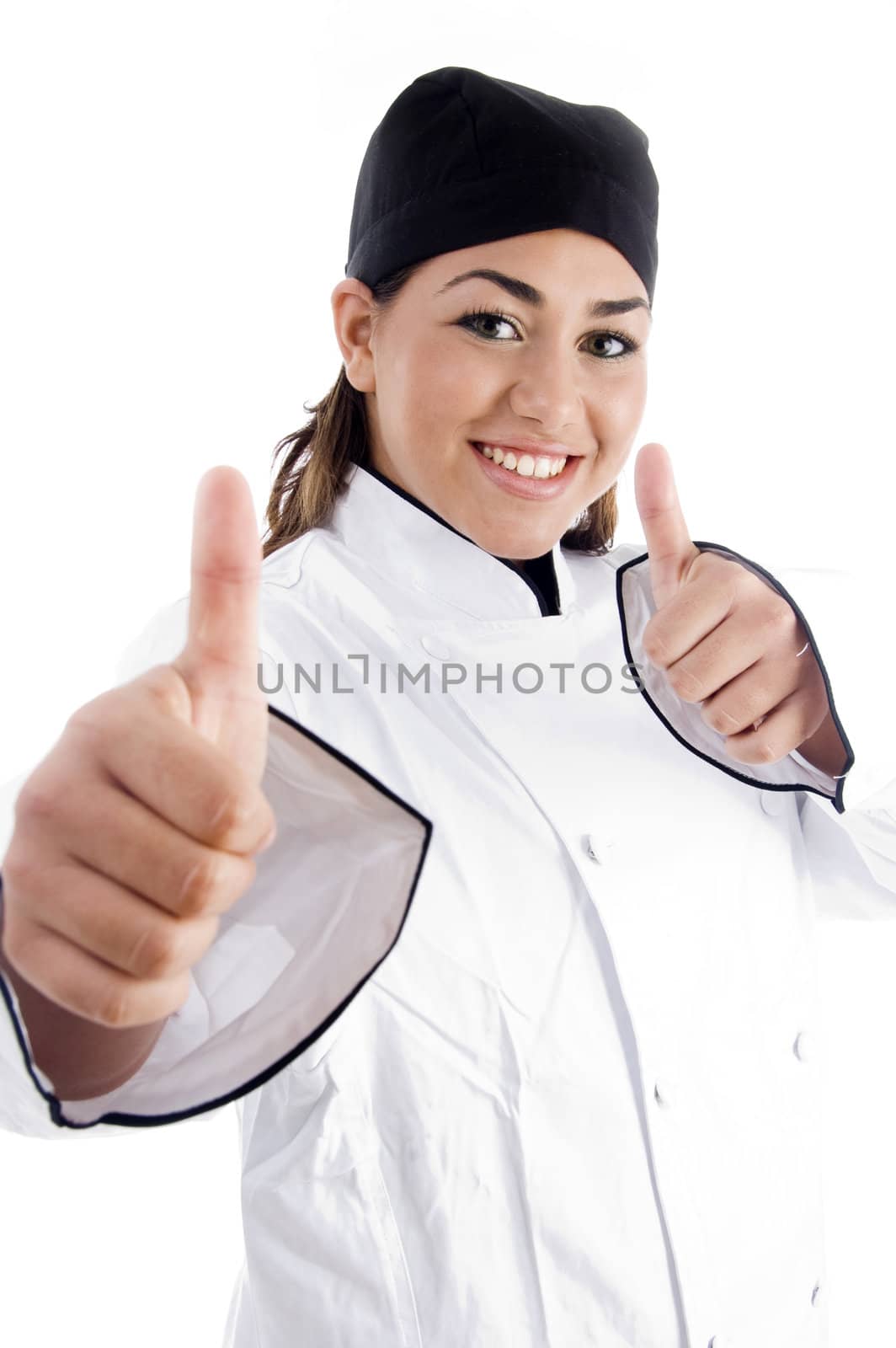successful female chef showing thumbs up by imagerymajestic