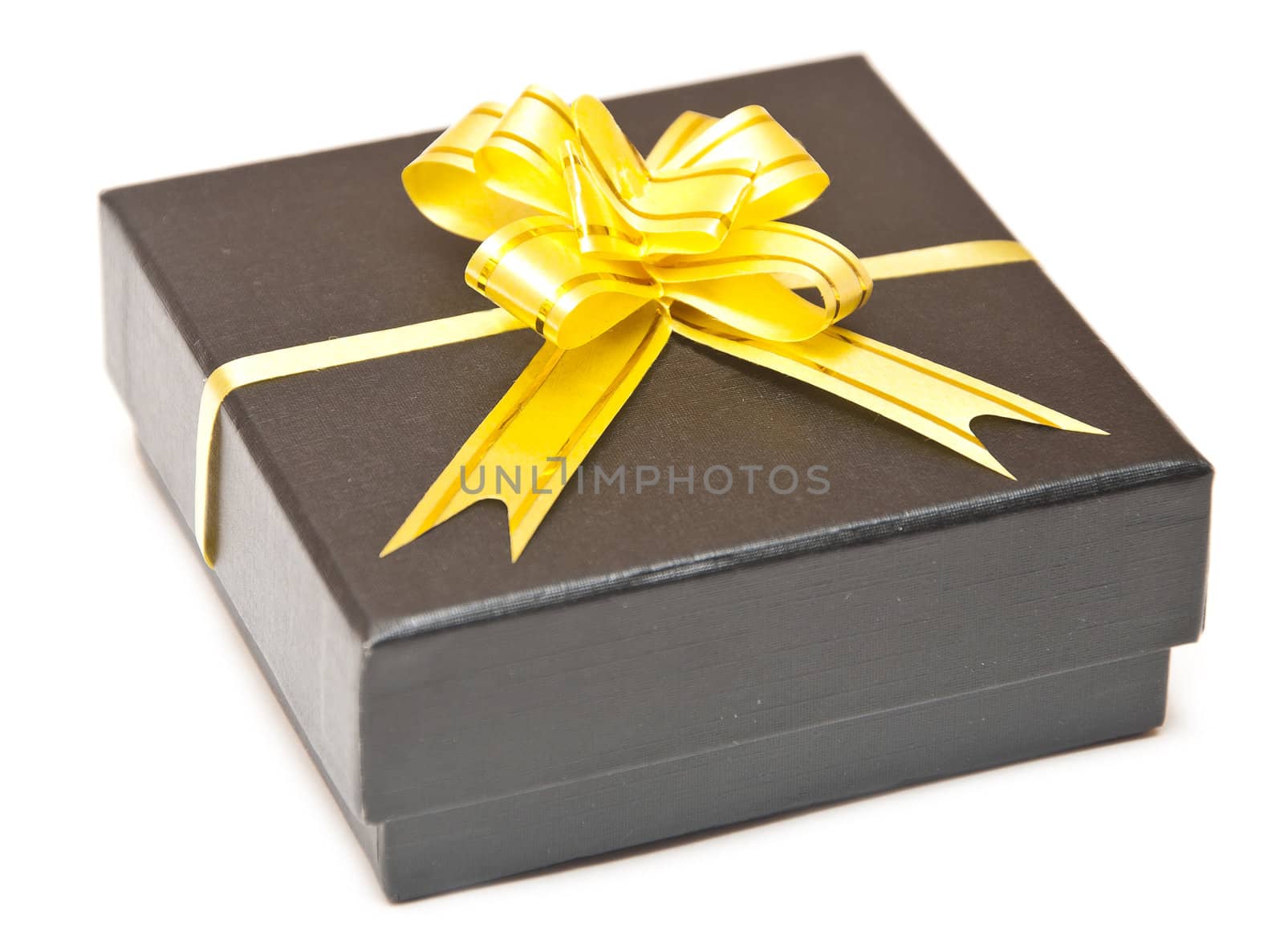 black gift box with golden ribbon isolated over white background 