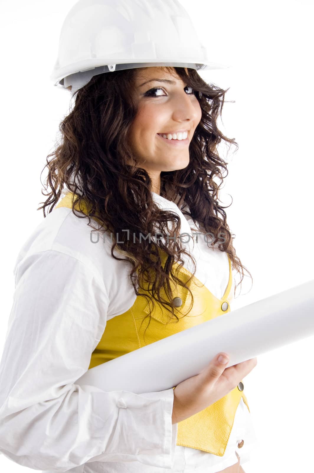 young female executive wearing hardhat and holding blueprints on an isolated white background