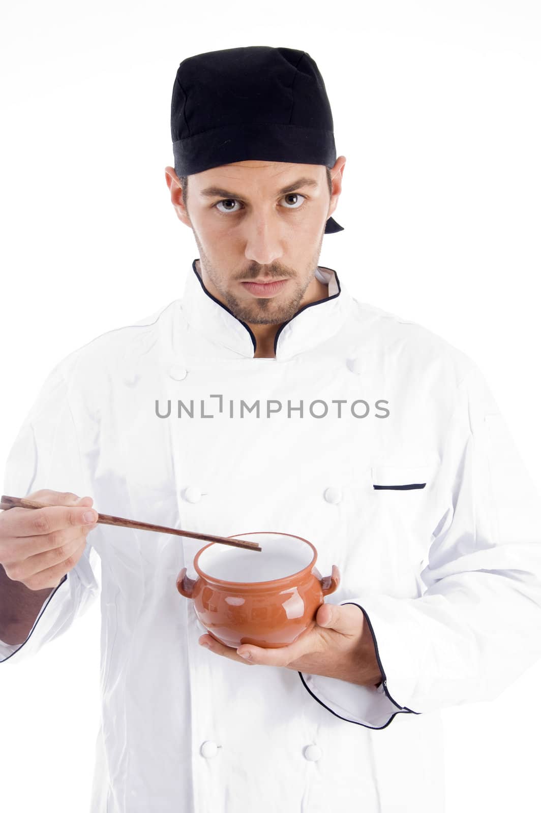male chef presenting chinese dish against white background