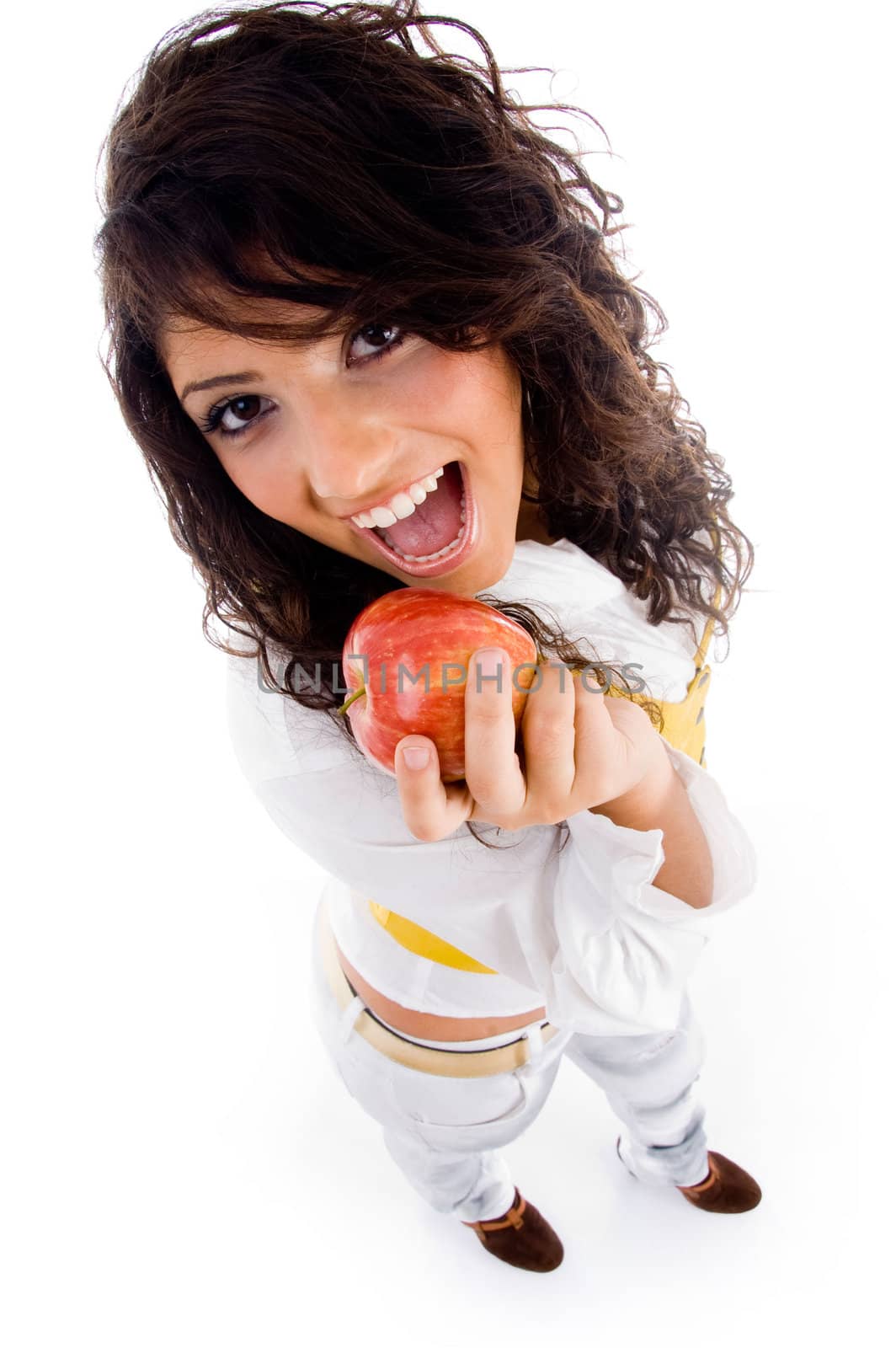 beautiful young woman holding red apple against white background