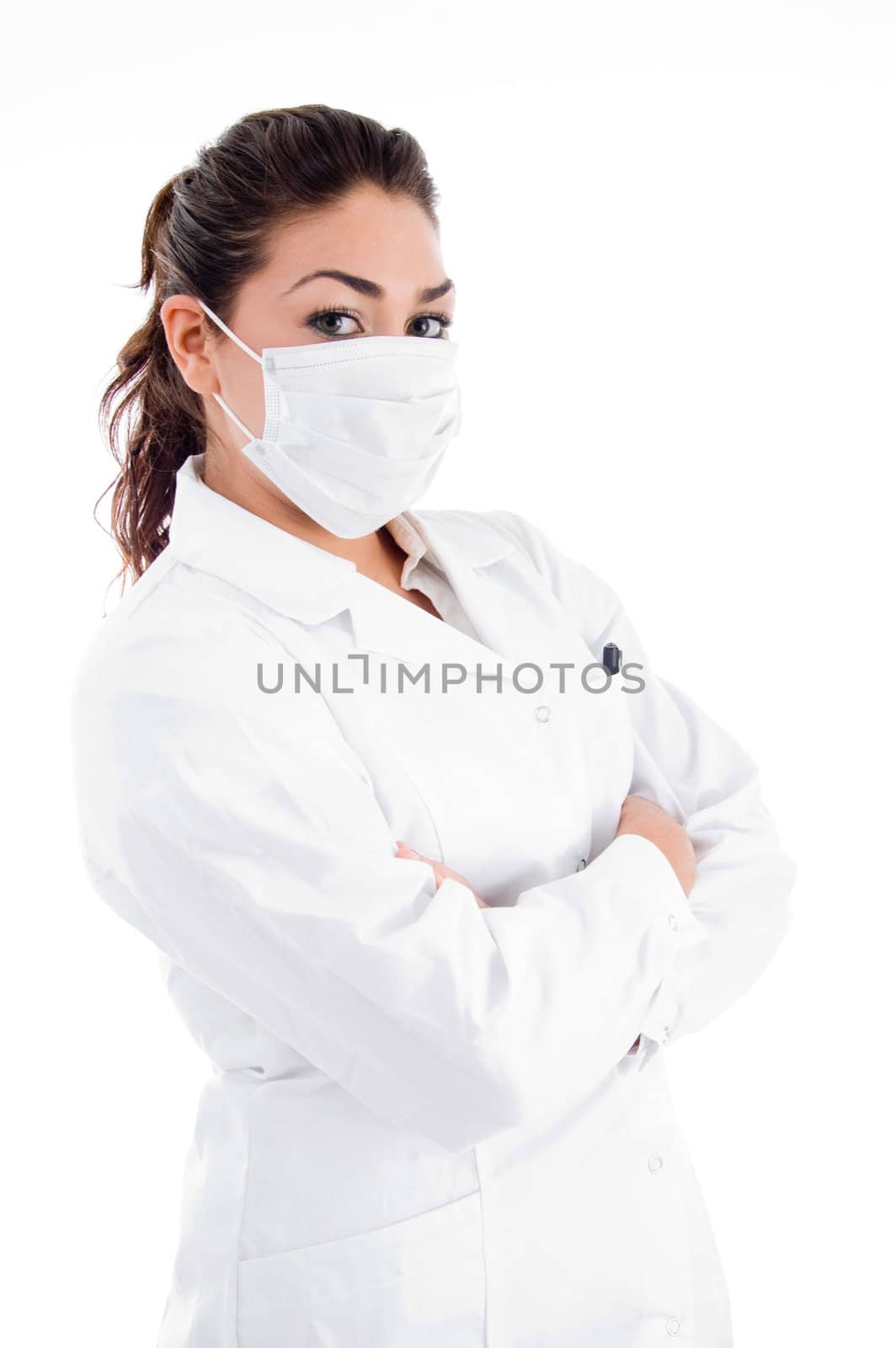 side pose of doctor with mask and folded hands against white background