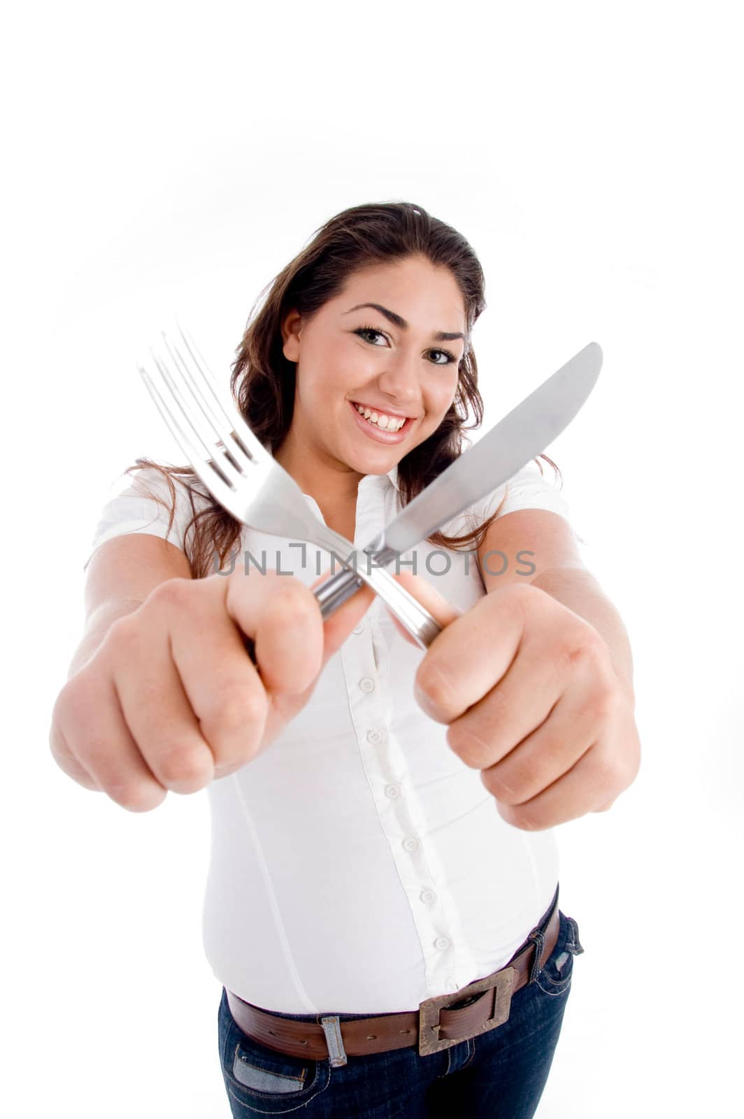young model holding fork and knife on an isolated white background