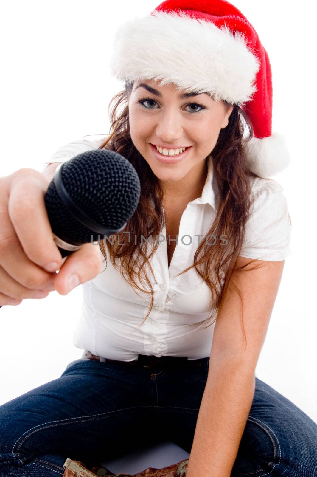 model wearing christmas hat and showing microphone on an isolated white background