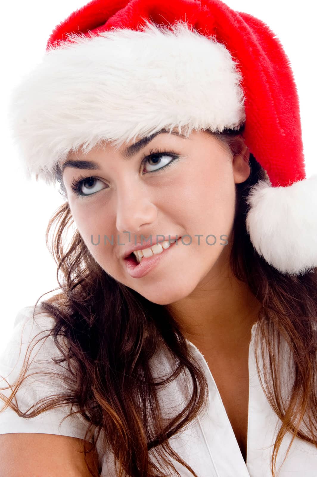 woman wearing christmas hat and looking upward on an isolated white background