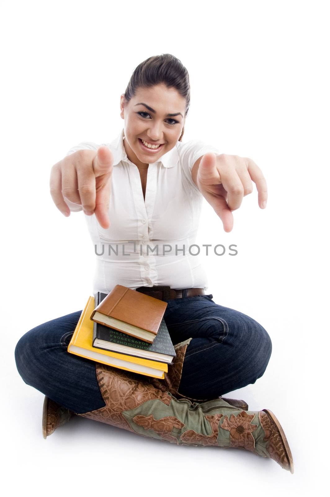 pointing smiling female with books on an isolated white background