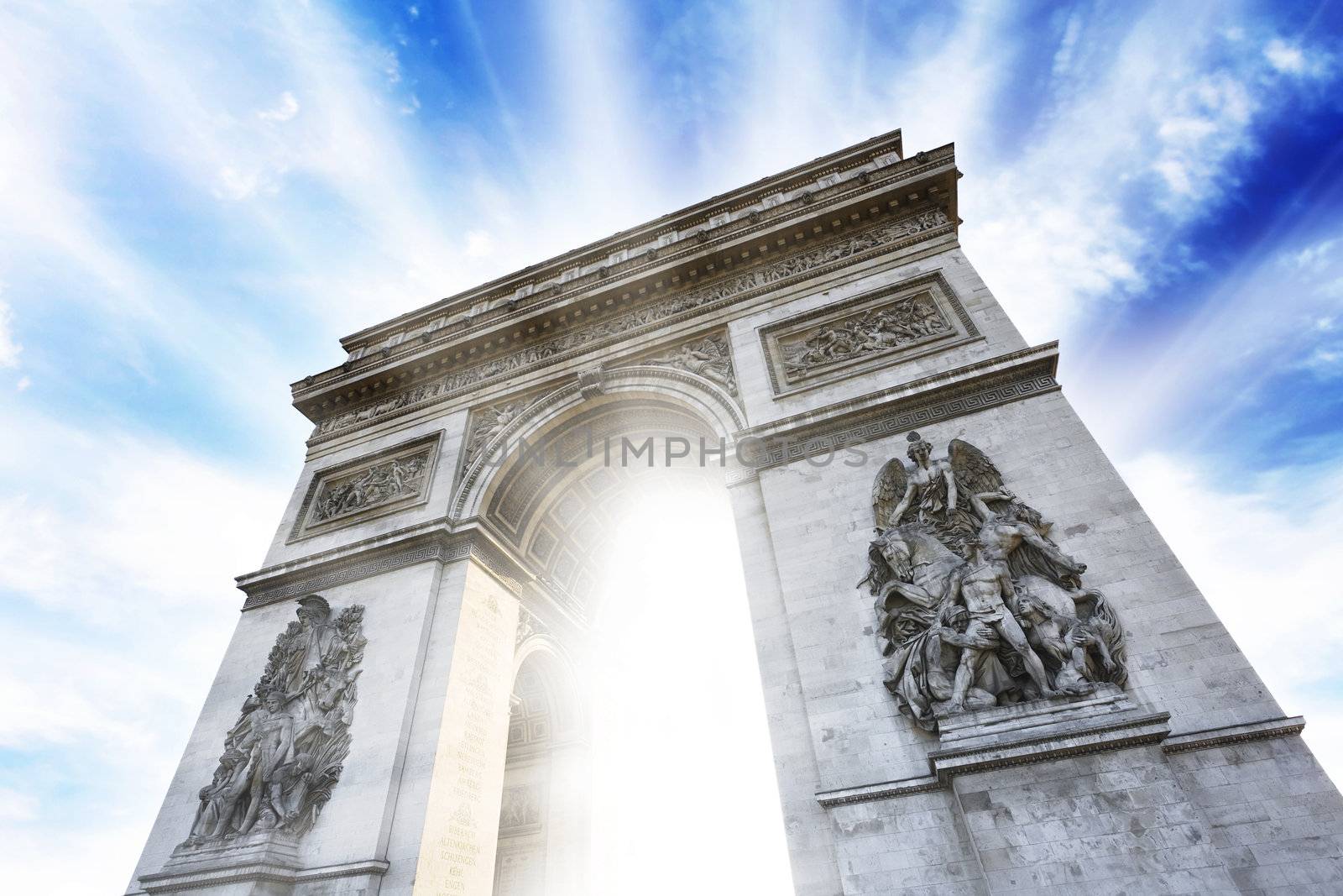 Photo of the Arc de Triomphe historical building in Paris flaring up with beautiful bright lights on a colorful cloudy sky background. Conceptual.