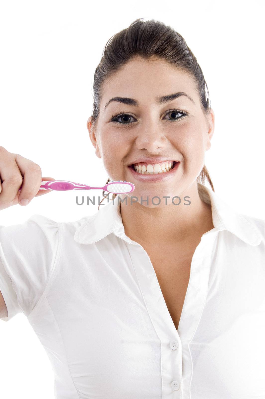 young woman holding toothbrush on an isolated background