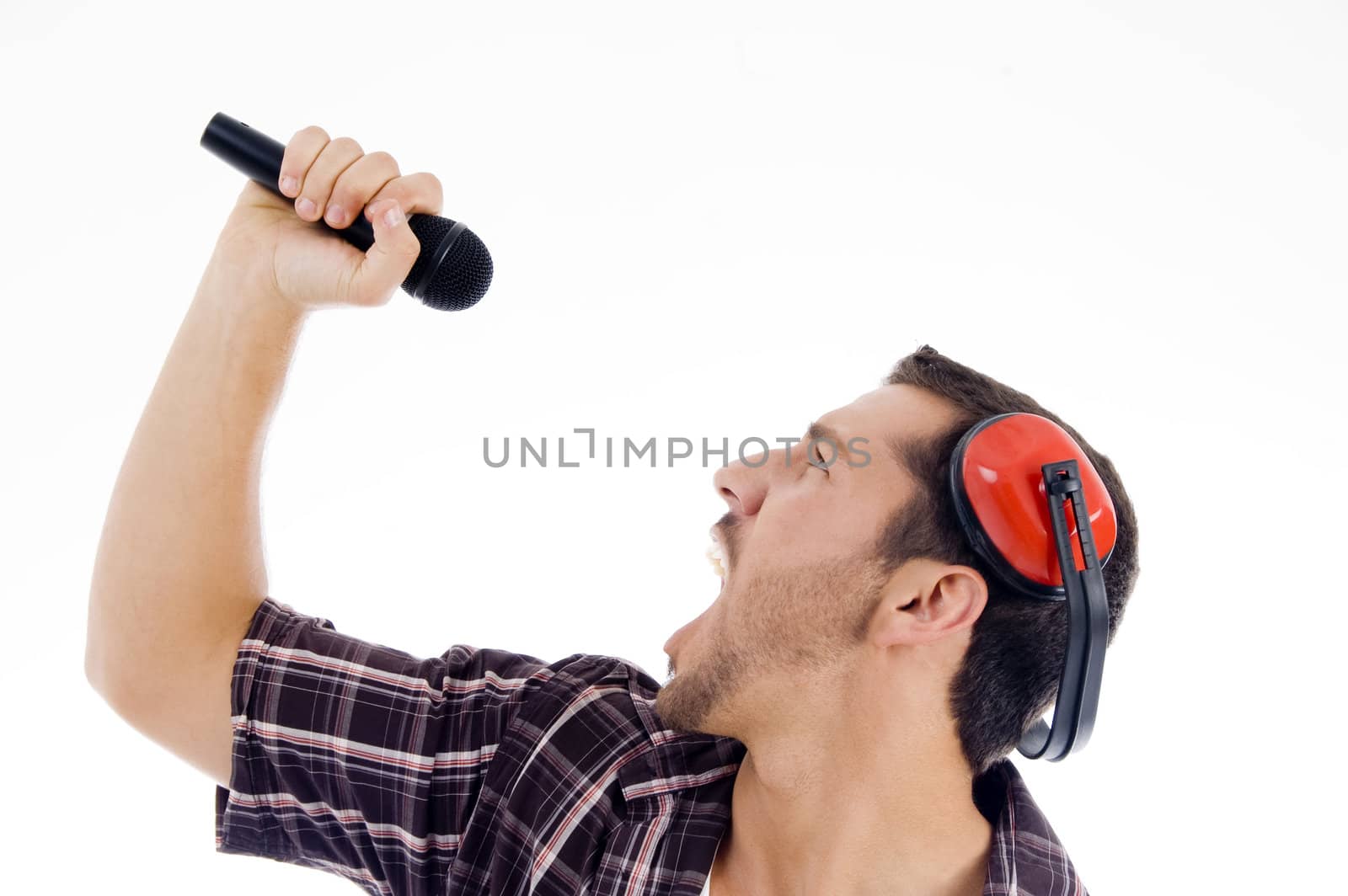 male singing loudly on microphone on an isolated white background