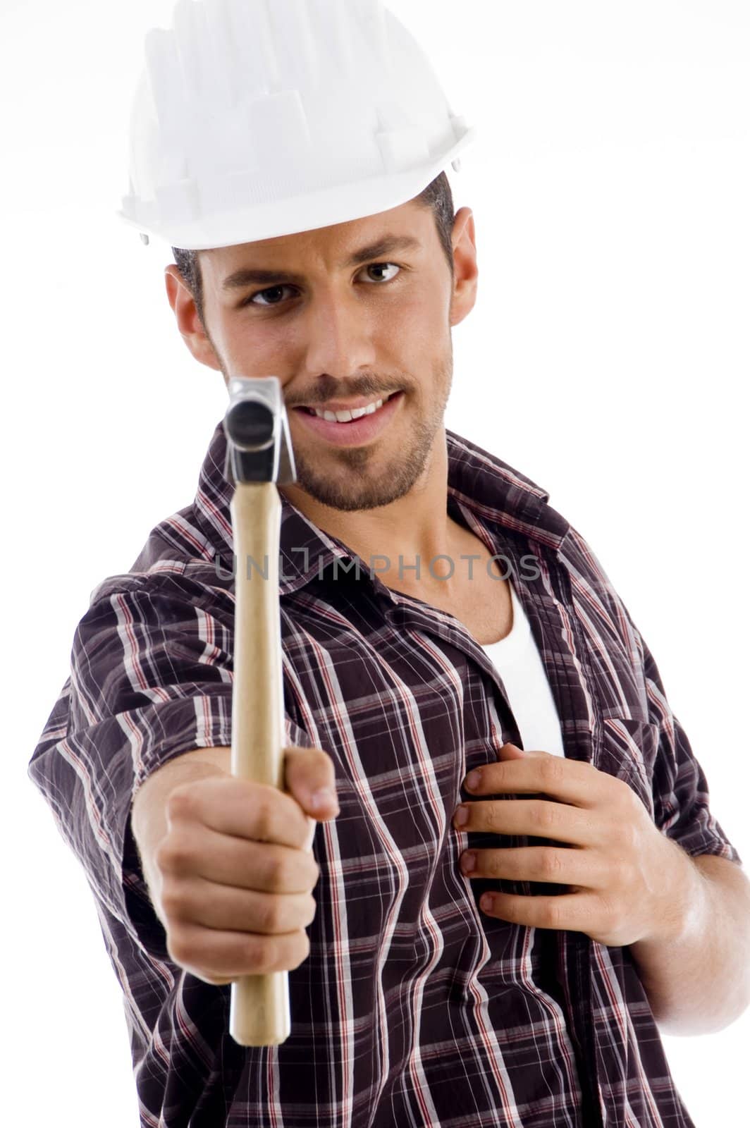smiling engineer showing hammer against white background