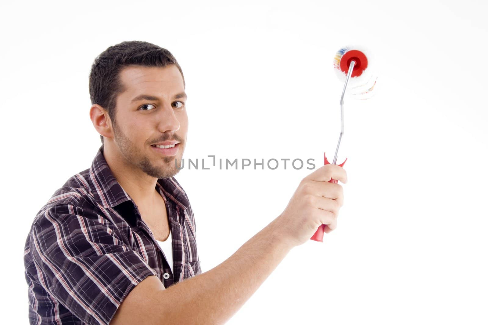 male holding roller brush against white background