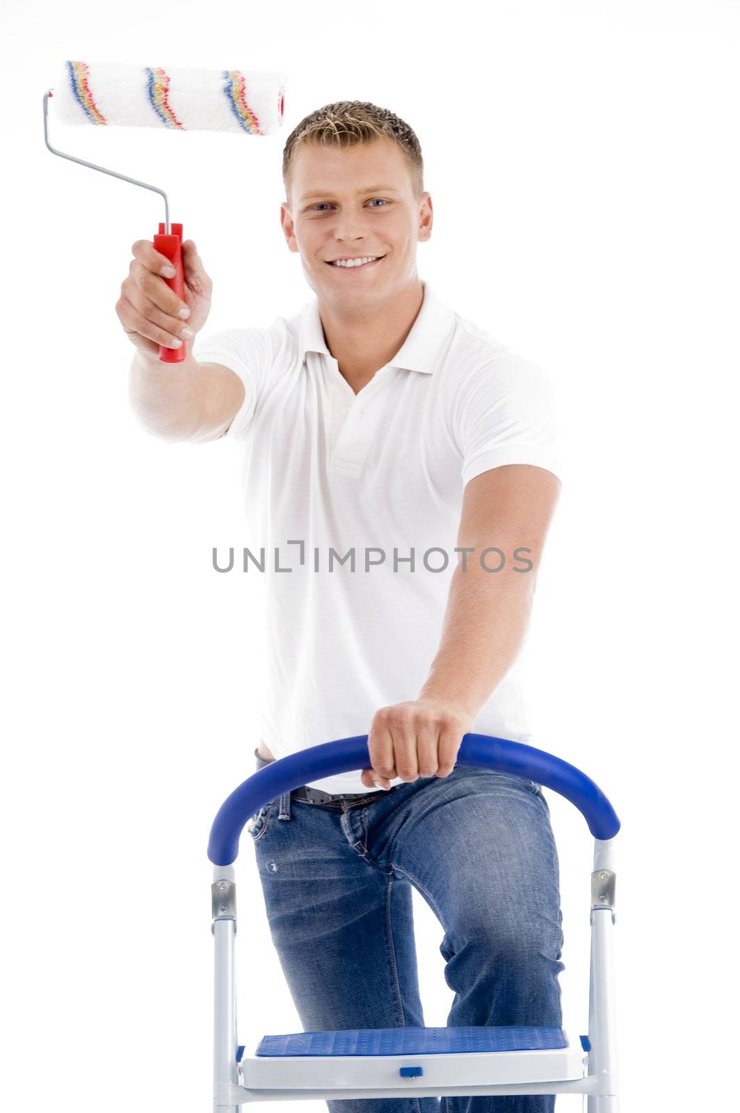 front pose of smiling male holding brush on an isolated white background