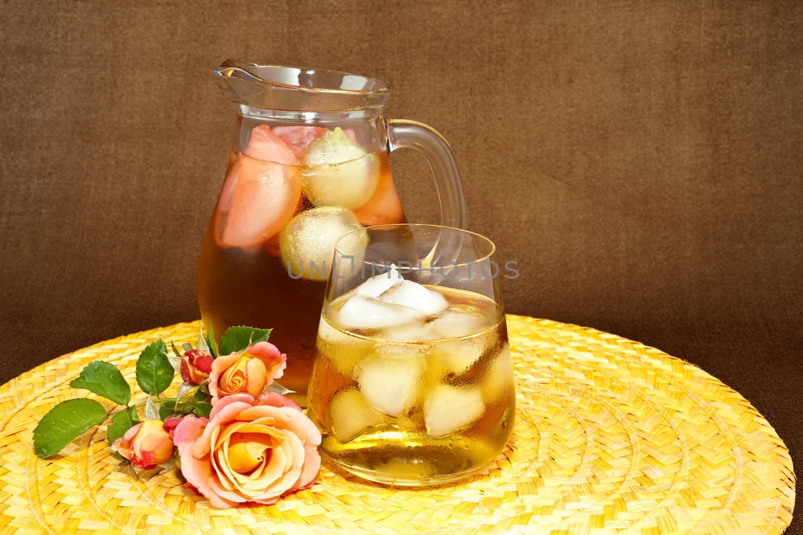 Drink with ice on colored background and contrasting
