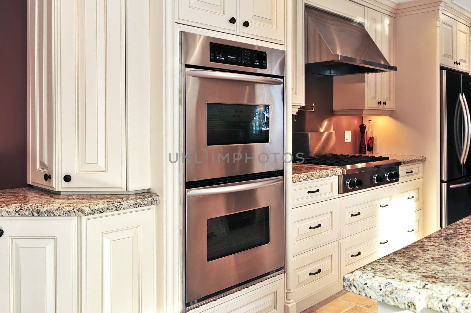 Interior of modern luxury kitchen with stainless steel appliances