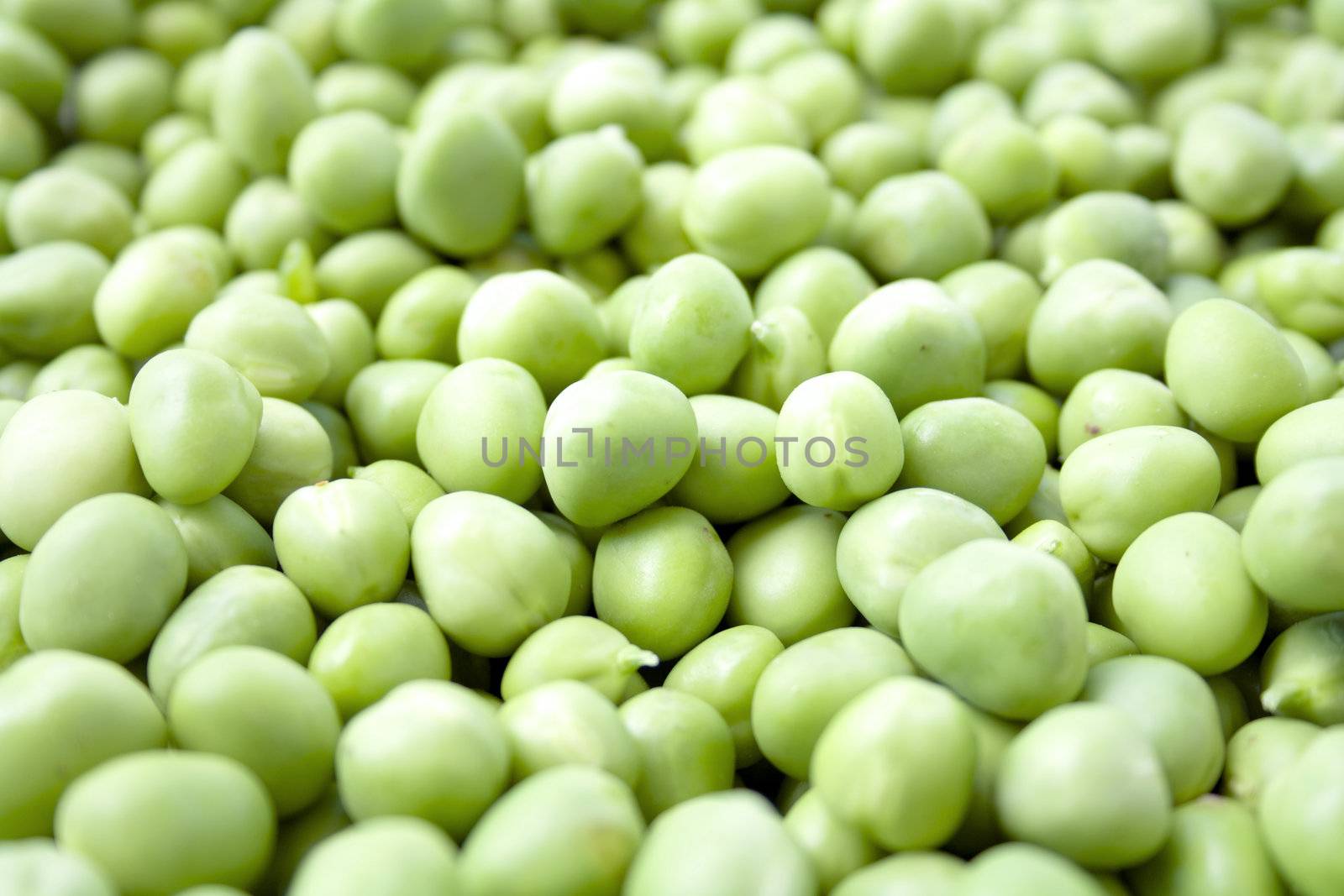 Background from green peas. Macro photo.