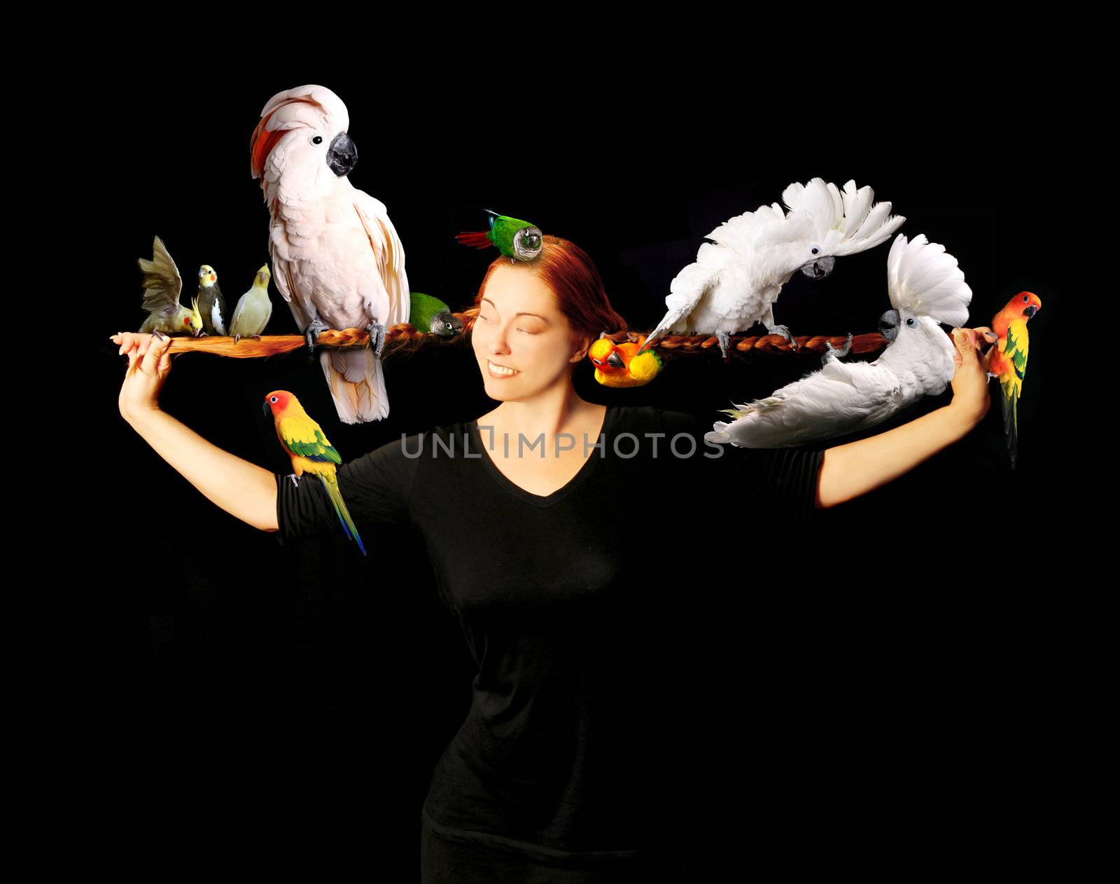Woman Who Has Multiple Exotic Birds in Her Very Long Red Hair