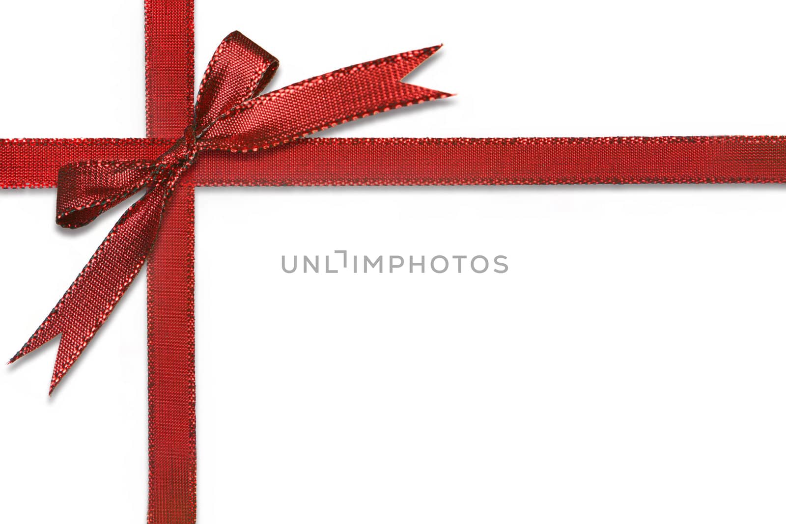 Christmas Gift Wrapped in Pretty Red Bow Isolated on White Background