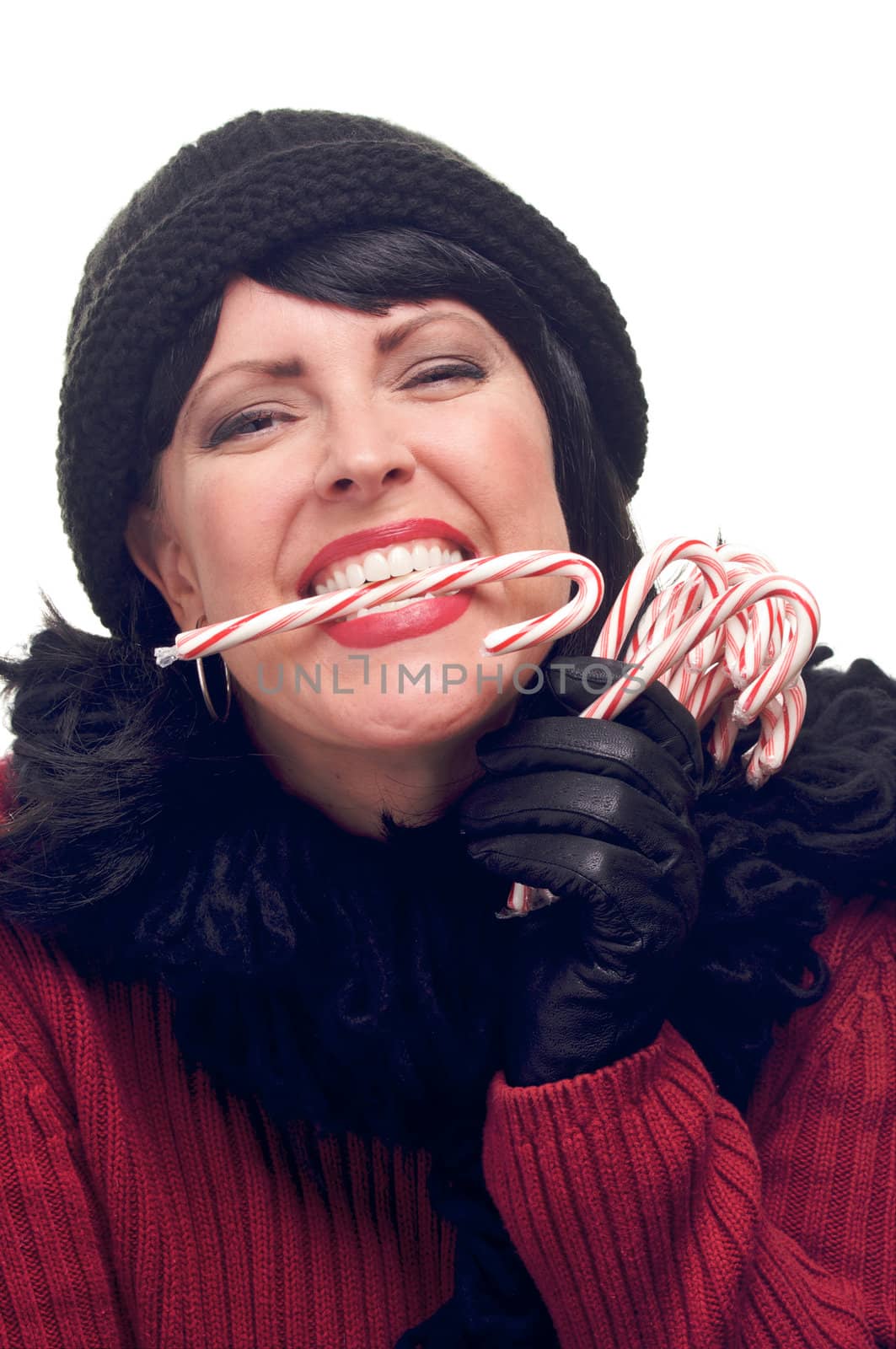 Attractive Woman Holds Candy Canes Isolated on a White Background.