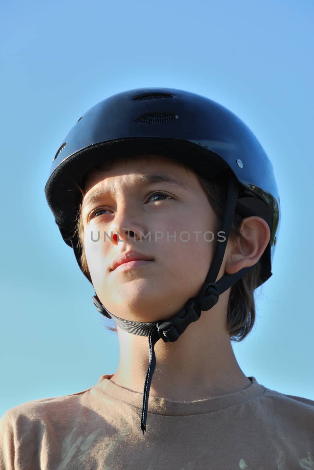 Portrait of a boy wearing a skateboard helmet