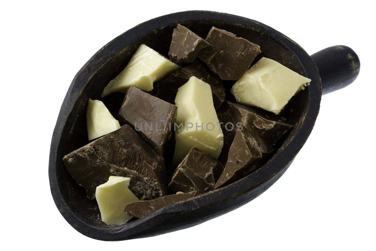chunks of milk and white chocolate on a rustic, wooden scoop isolated on white