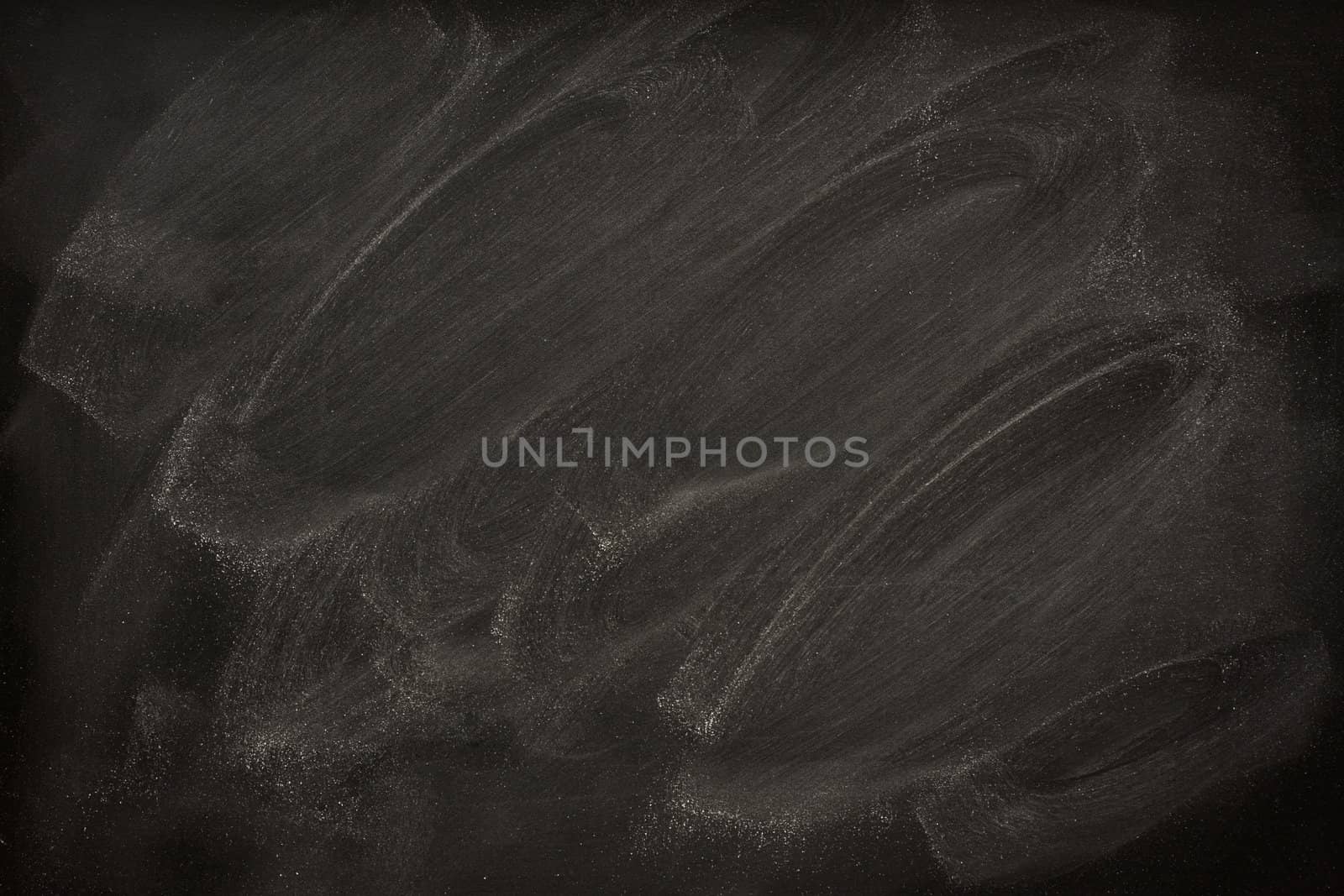 blank blackboard with chalk smudges by PixelsAway