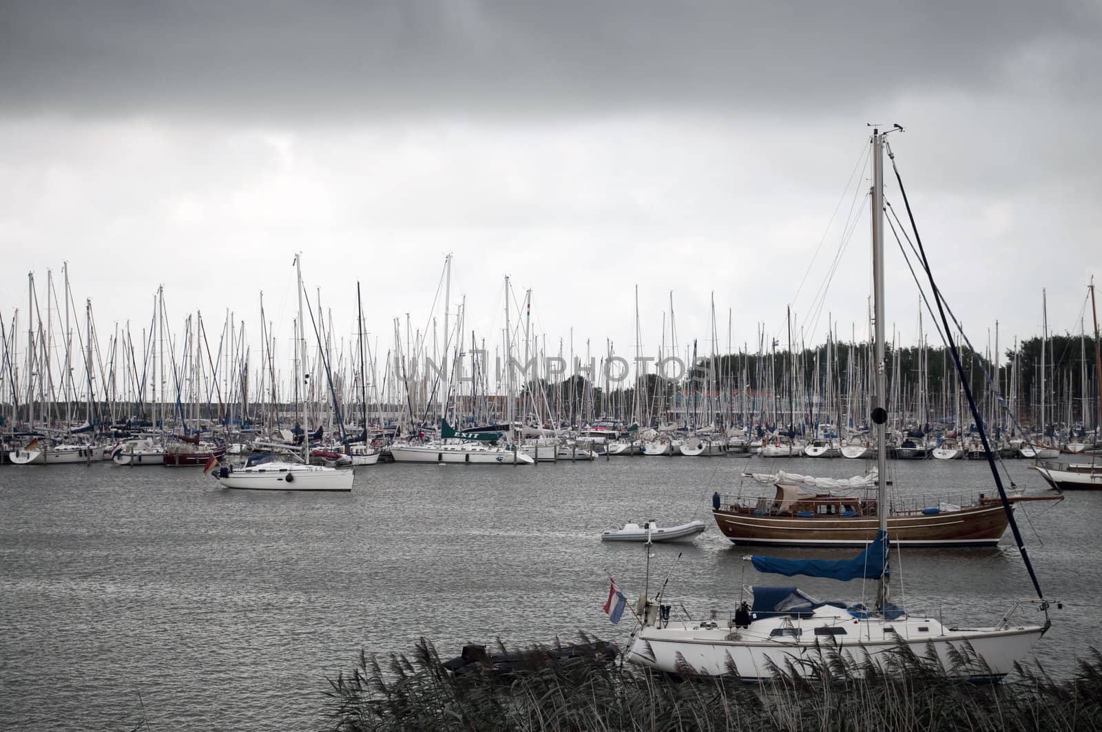 moored Saling boats in an harbor during bad weather
