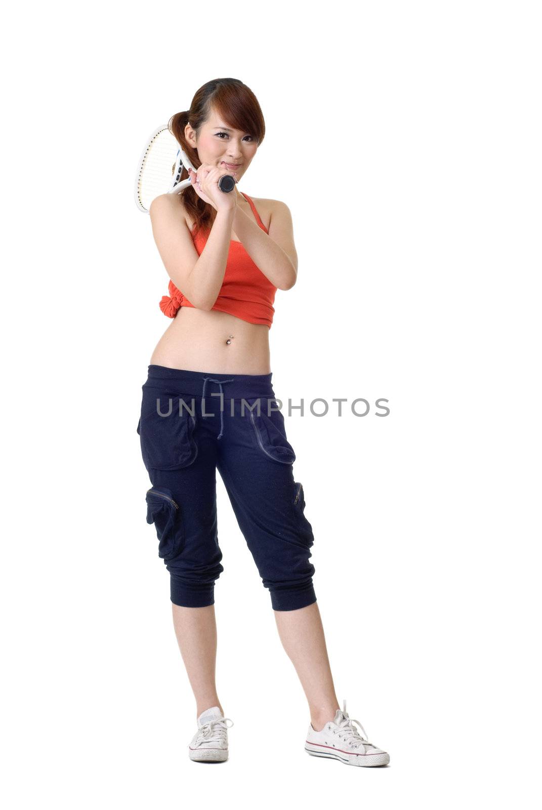 Cute athlete girl holding tennis racket standing isolated on white.