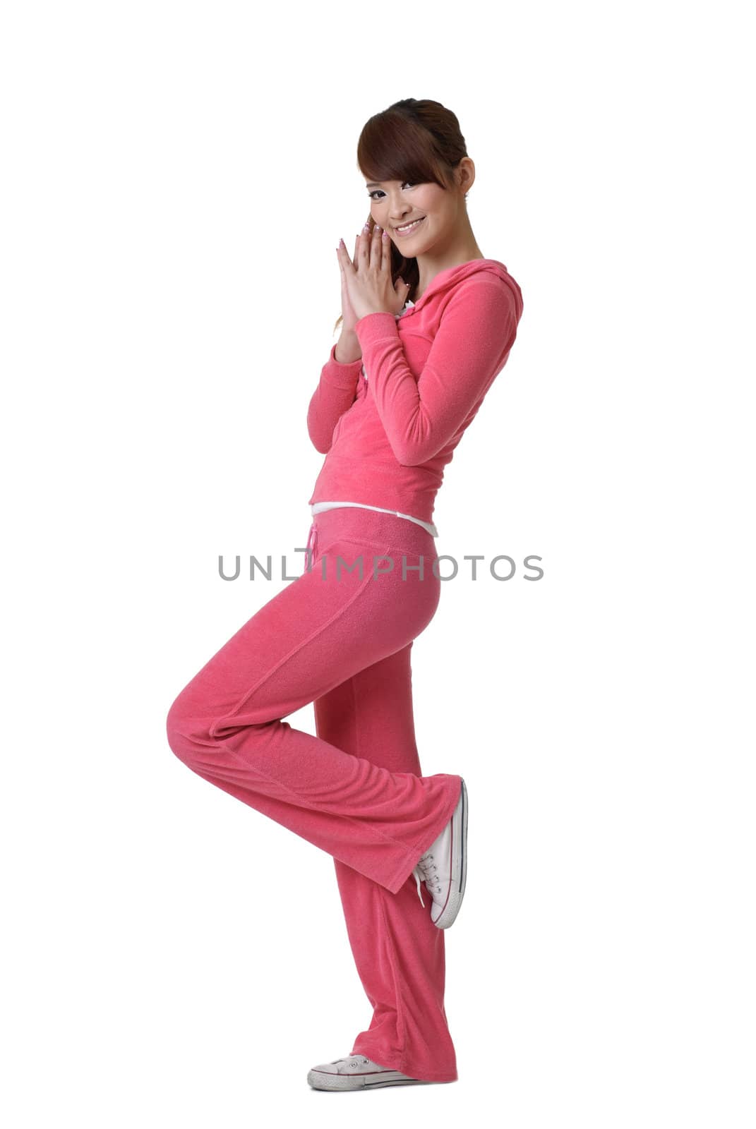 Fitness girl in pink, full length portrait isolated on white.