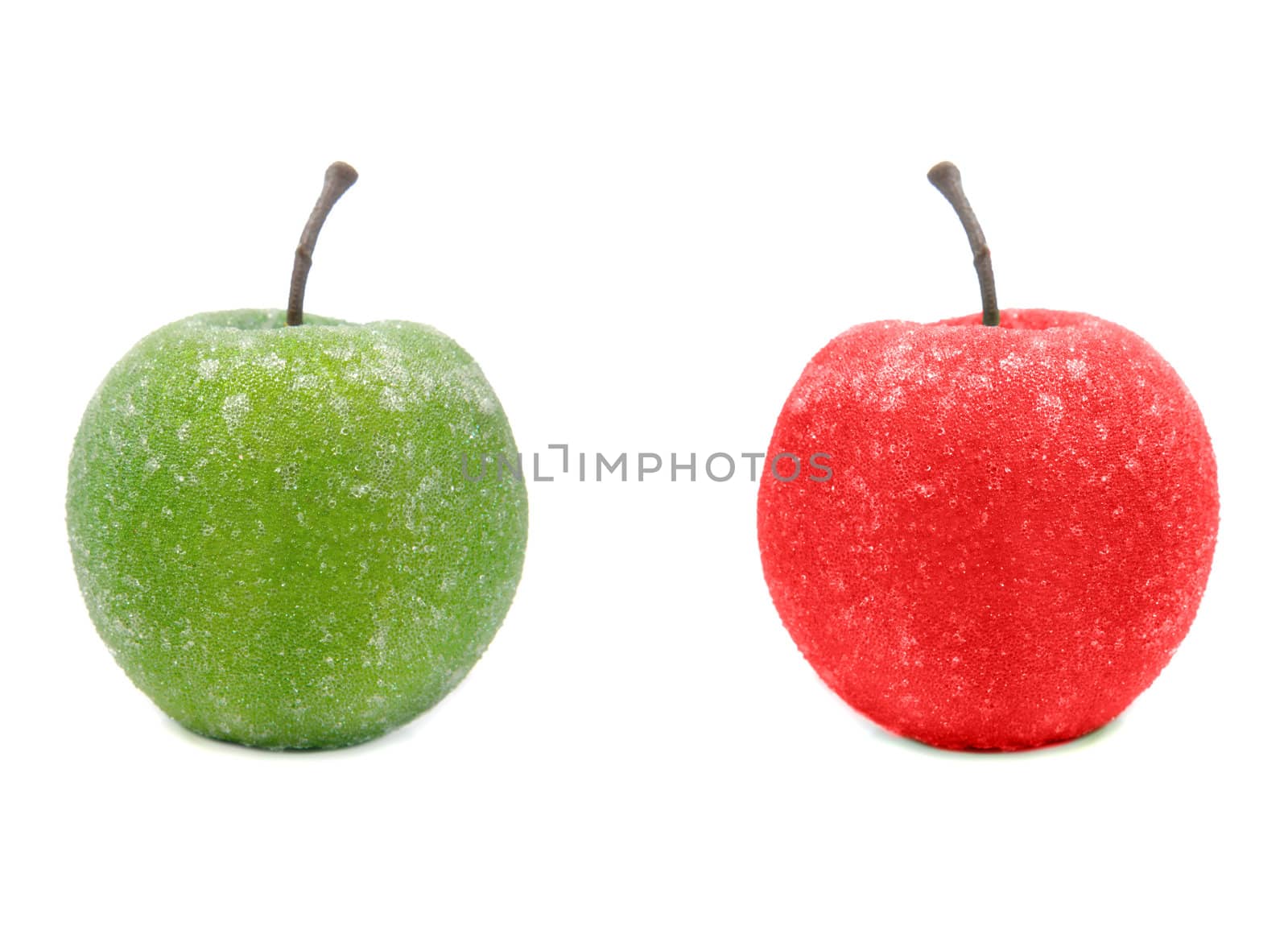 A fake green and red apple isolated against a white background.