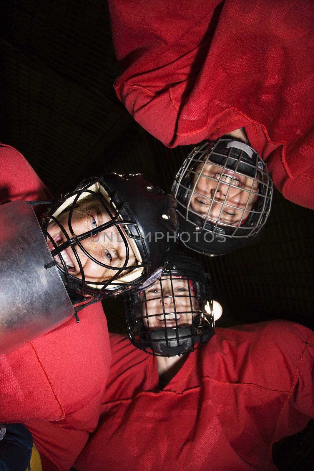 Women hockey player huddle. by iofoto