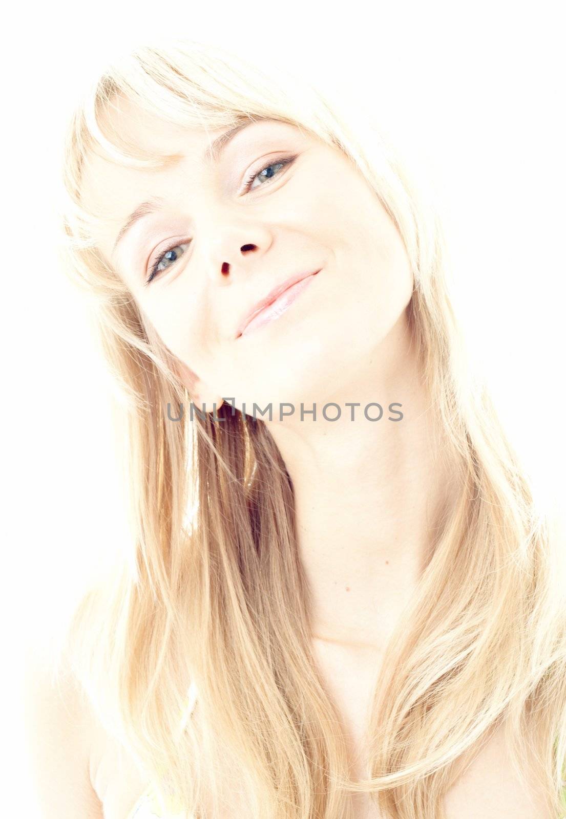 hi-key image of smiling blond