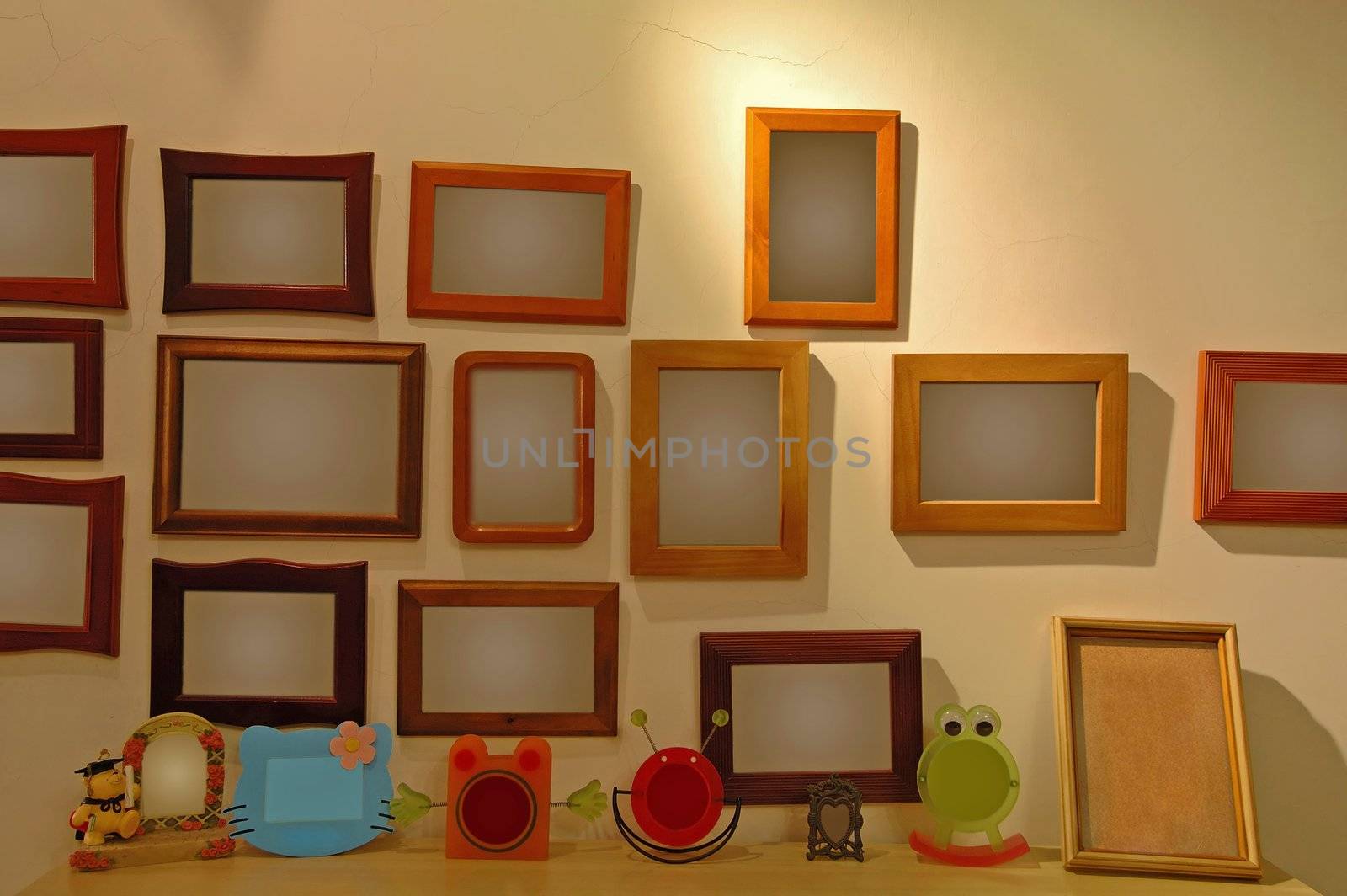 The photo frames hanging on a wall of a house