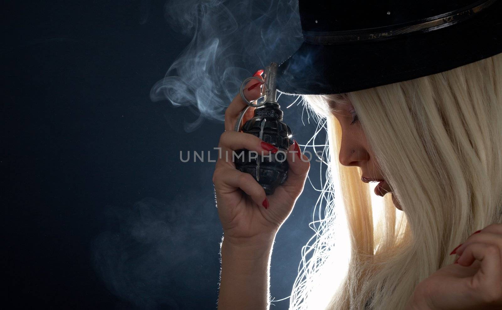 backlight image of pretty girl with grenade